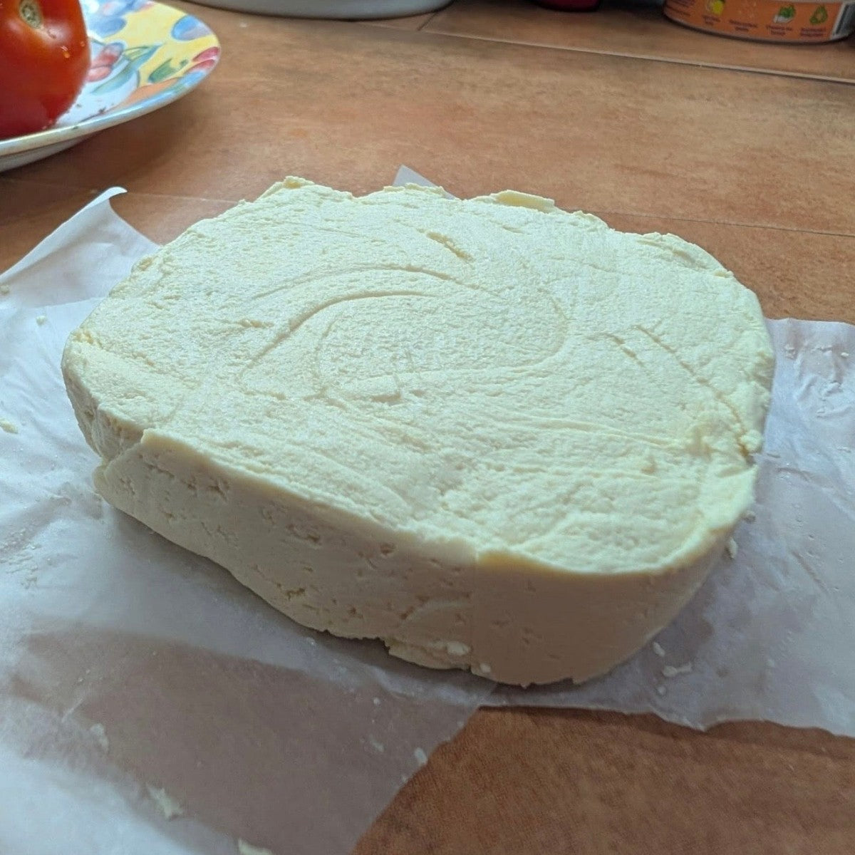 Block of homemade plant-based cheese made by a MioMat owner