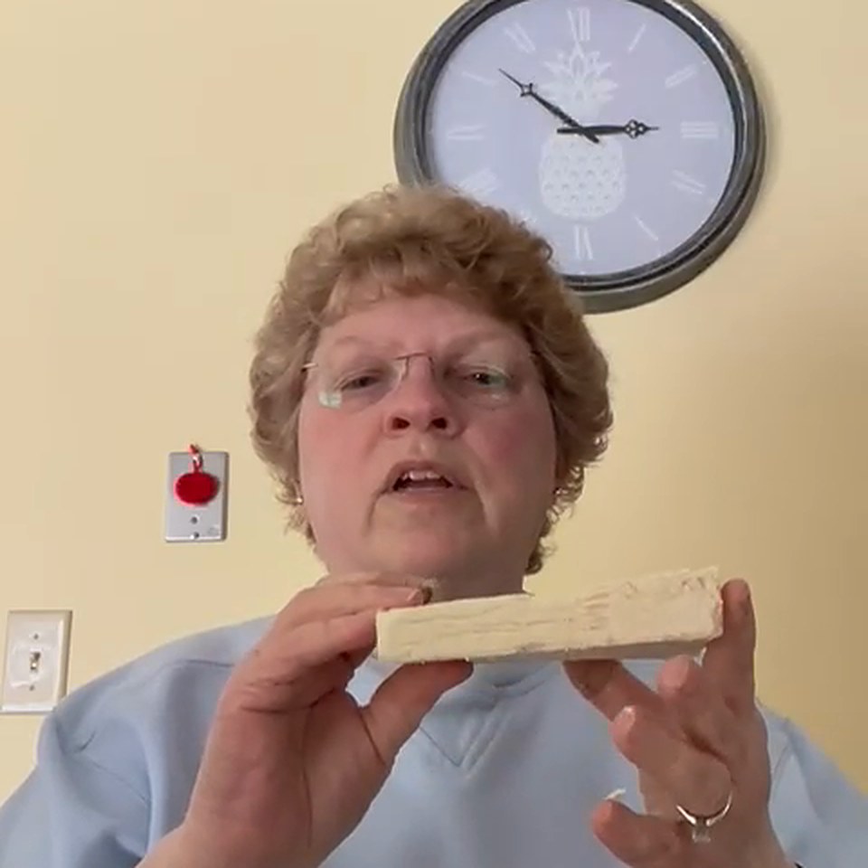 MioMat owner Lynne holding the cheese she made