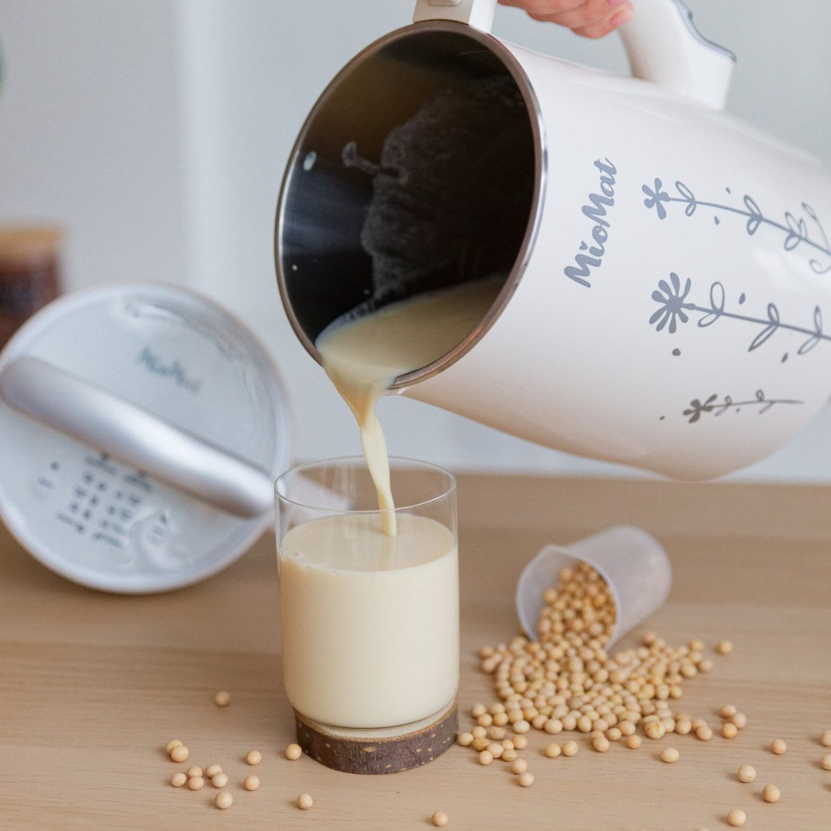Fresh soy milk poured from the MioMat into a glass